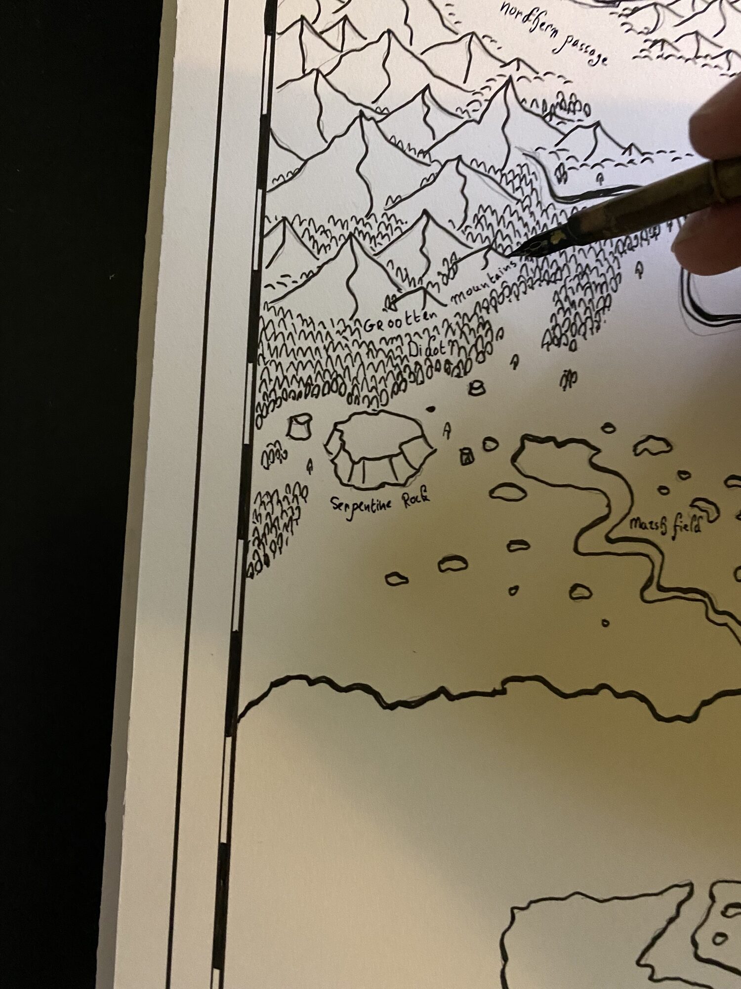 Chaim Holtjer inking mountains and forests on the Pennymores map